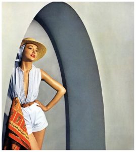 model-in-carolyn-schnurers-white-oxford-cloth-shorts-and-top-with-white-cord-passementerie-based-on-a-djellabah-photo-by-louise-dahl-wolfe-in-tunisia-for-cover-of-harpers-bazaar-june-918x1024